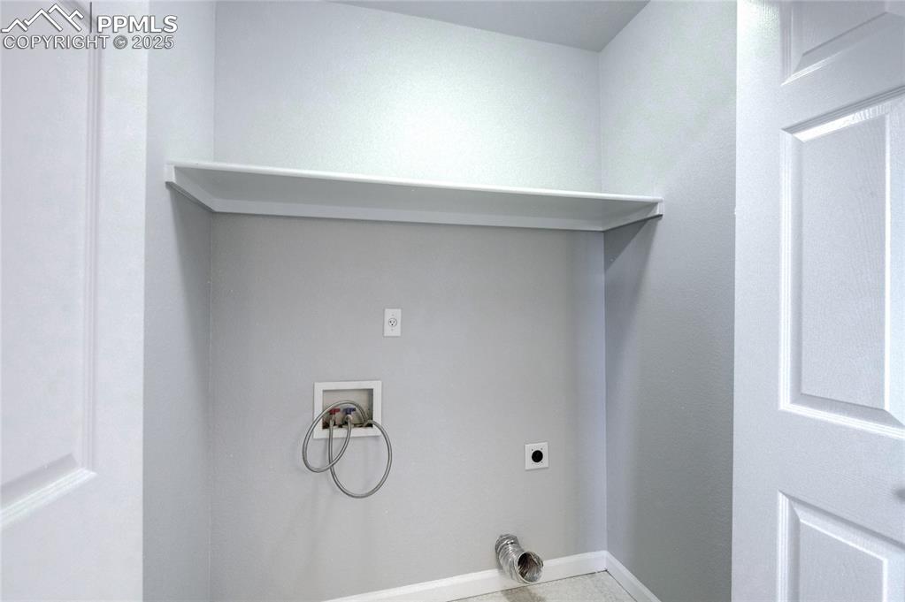 Image 19 of 23: Washroom featuring hookup for an electric dryer and hookup for a washing ma