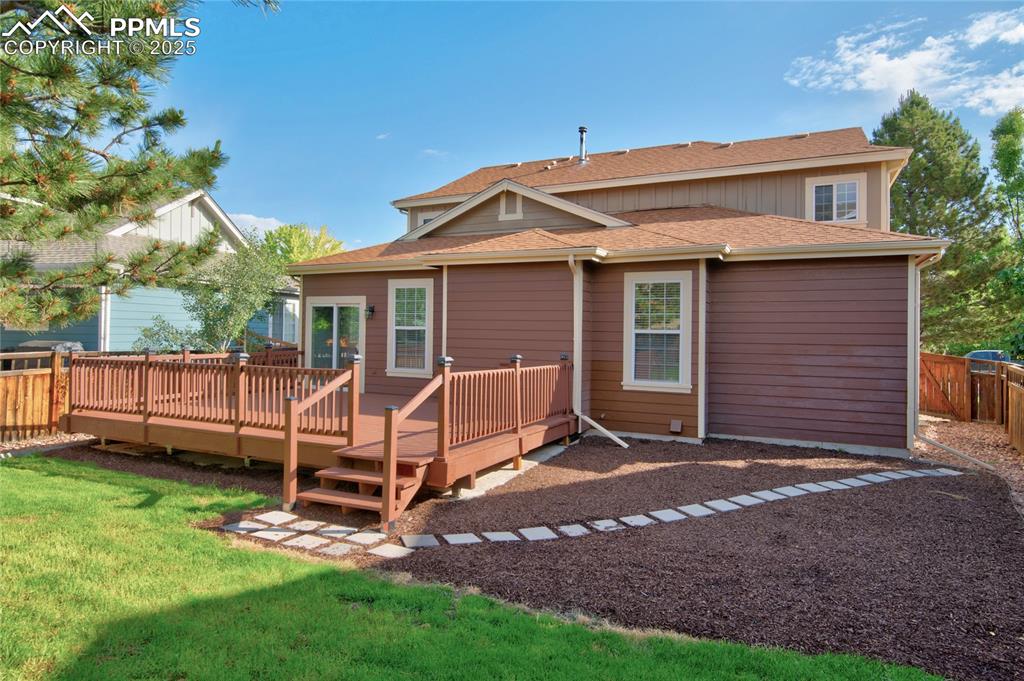 Image 23 of 23: Rear view of property with a deck and a shingled roof