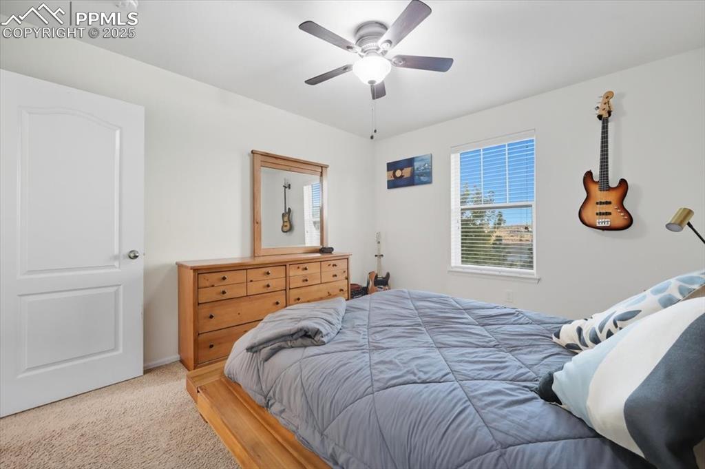 Image 16 of 35: Bedroom featuring carpet and ceiling fan