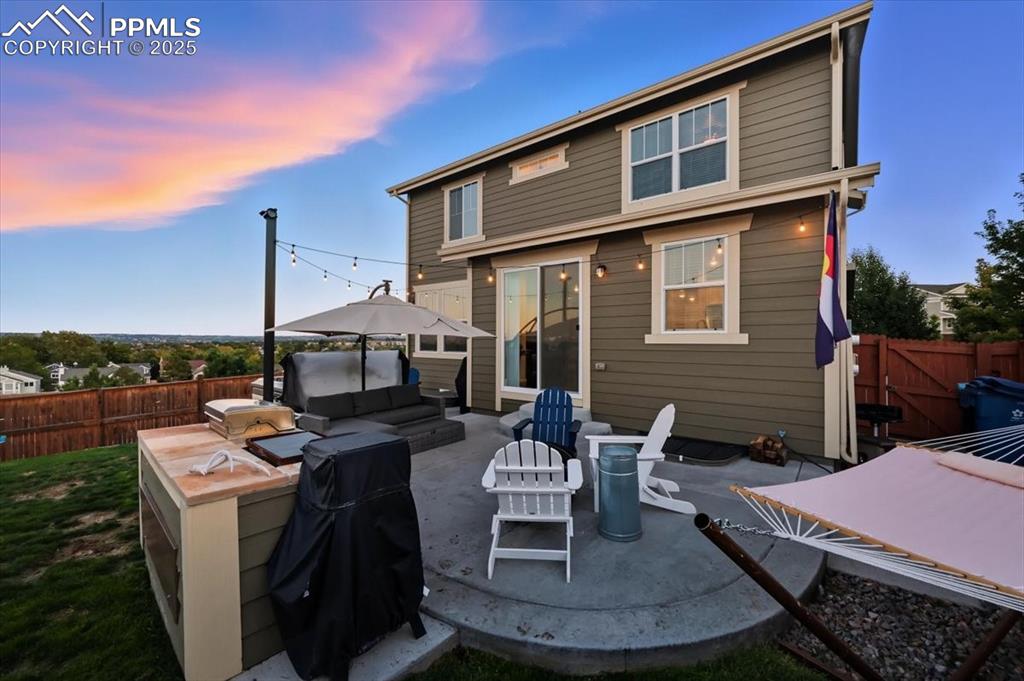 Image 21 of 35: Rear view of property with a fenced backyard, a patio area, and an outdoor