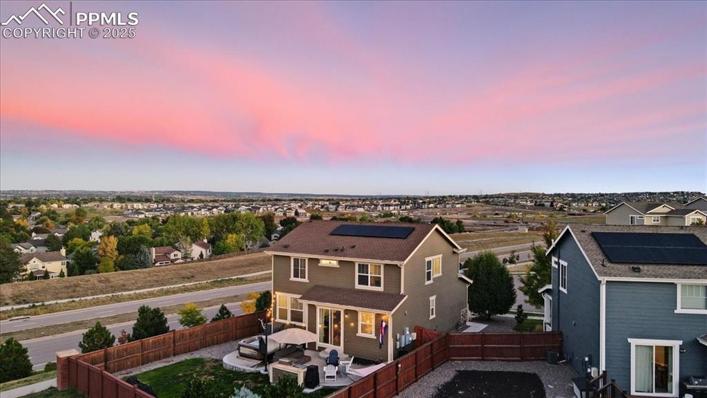 Image 27 of 35: Aerial view at dusk of a residential view