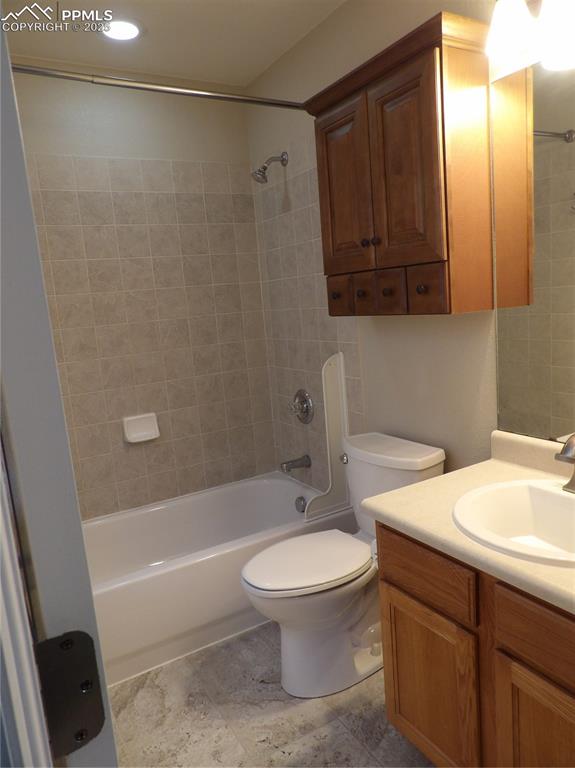 Image 16 of 23: Full bathroom featuring vanity and shower / tub combination