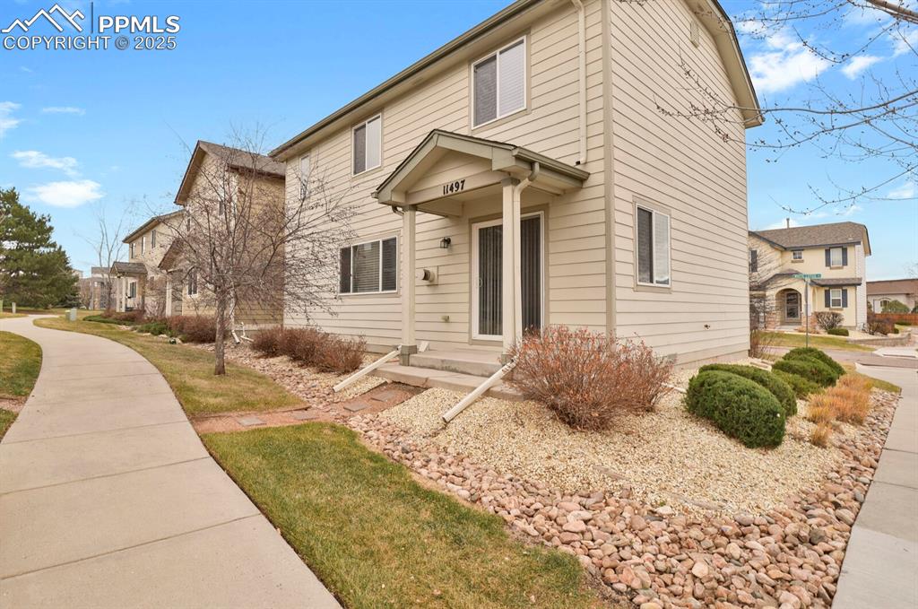 Image 25 of 26: View of front of house featuring a front yard