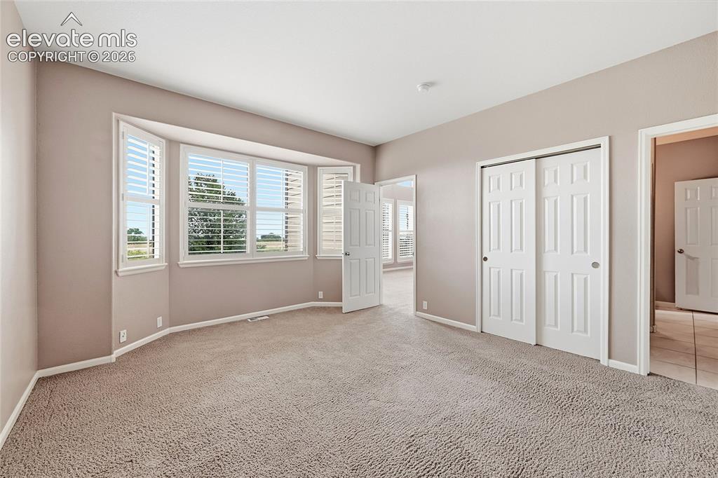 Image 15 of 50: Main Level Bedroom