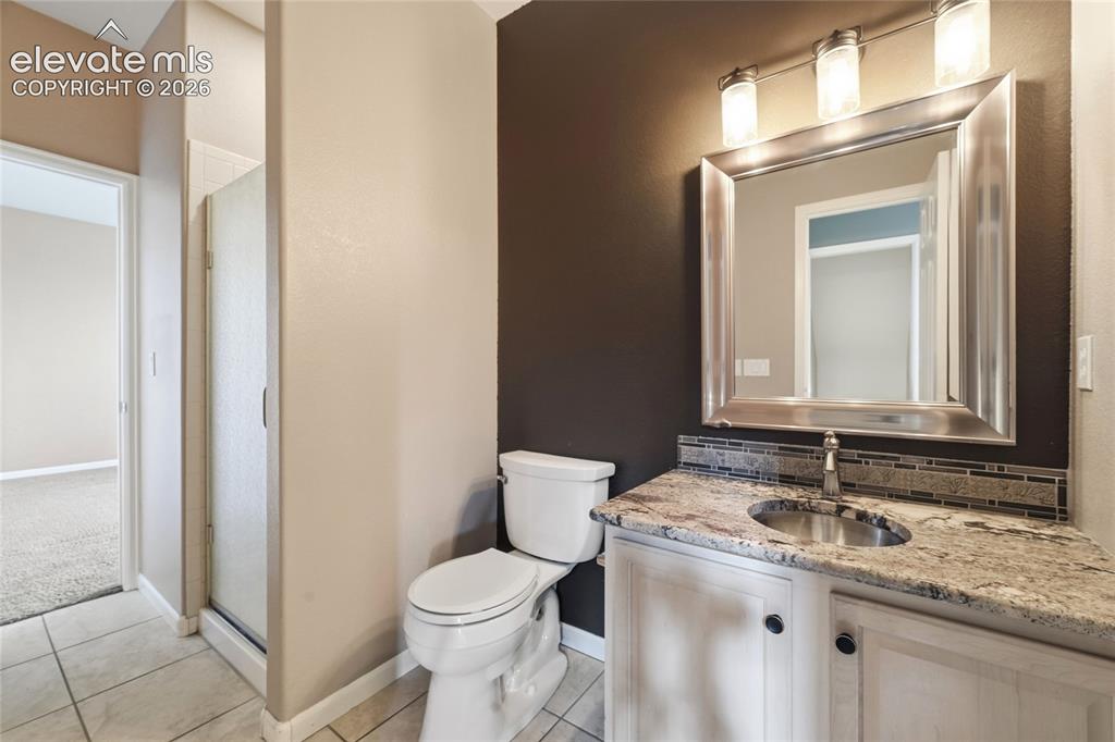 Image 16 of 50: Bathroom attached to Main Level Bedroom