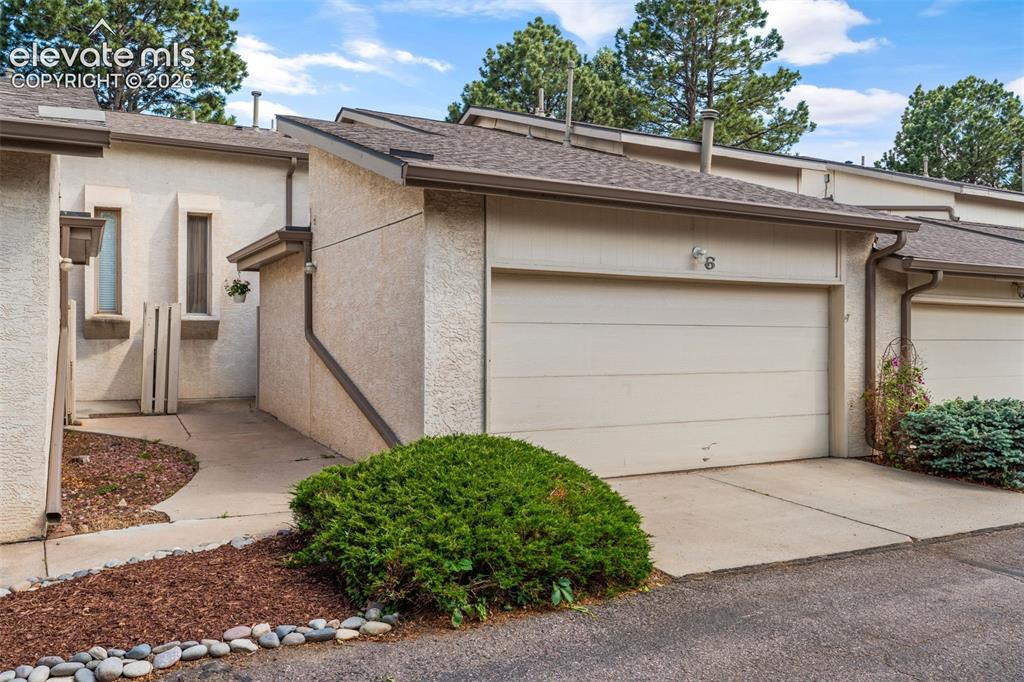Image 1 of 40: Two car garage and entryway to home