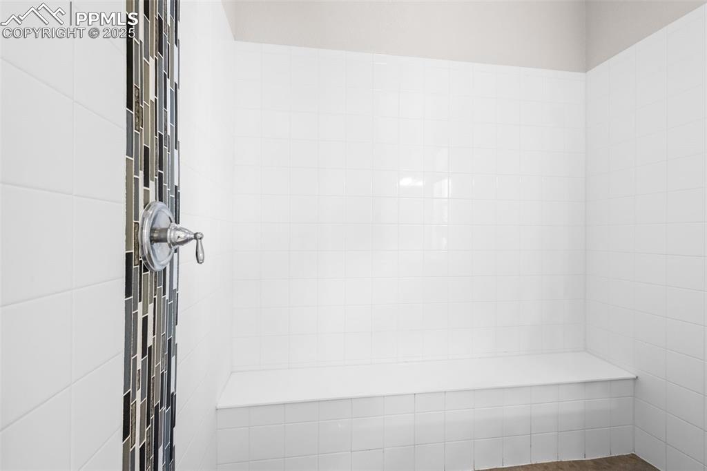 Image 18 of 47: Bathroom view of a tile shower