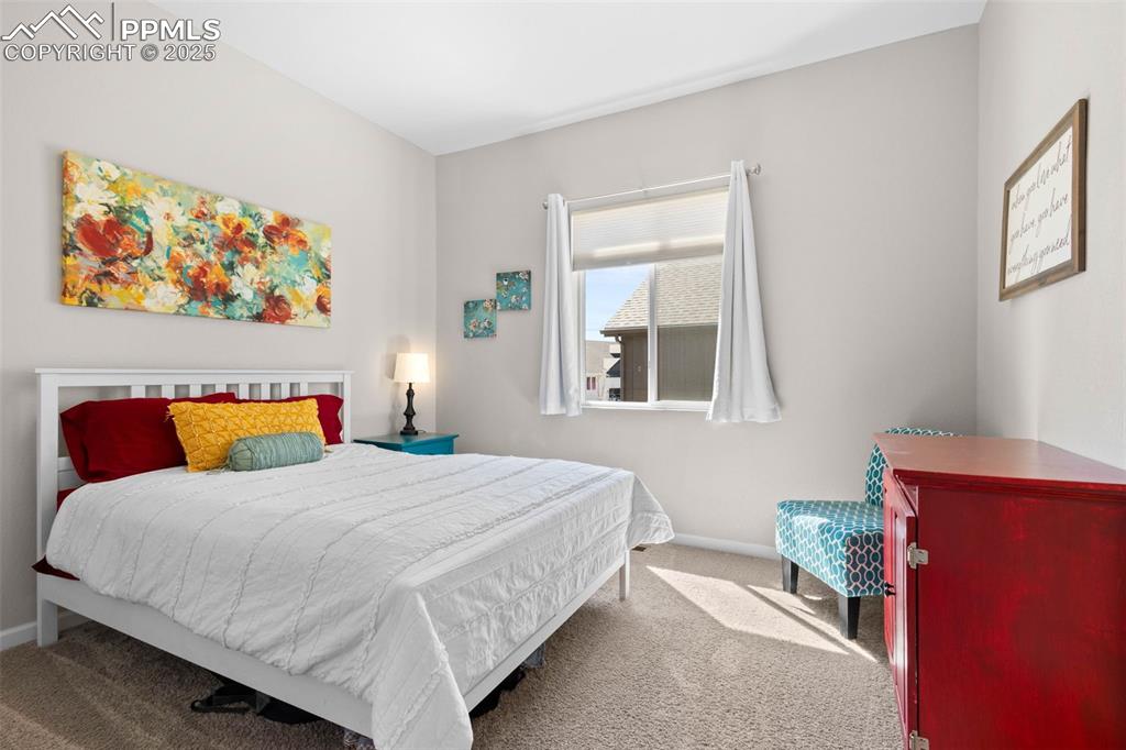 Image 19 of 47: Carpeted bedroom featuring baseboards
