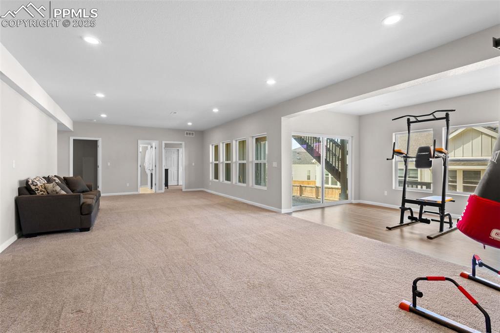 Image 30 of 47: Exercise area featuring recessed lighting and carpet floors