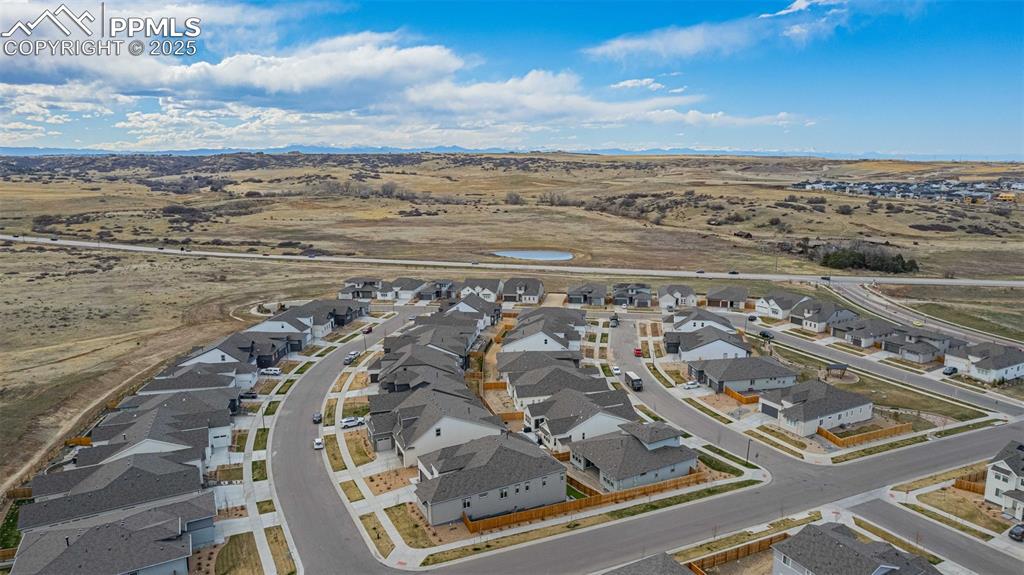 Image 47 of 47: View of rural area with nearby suburban area and a water and mountain view