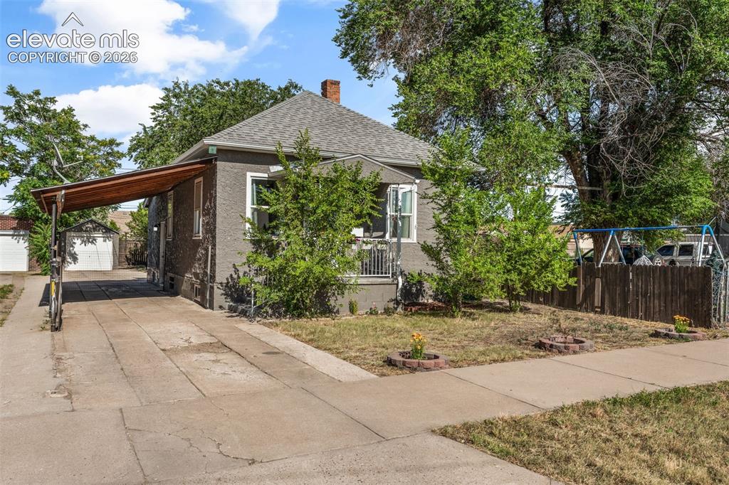 Image 1 of 50: Traditional single-story residence featuring a stucco exterior and a gray s