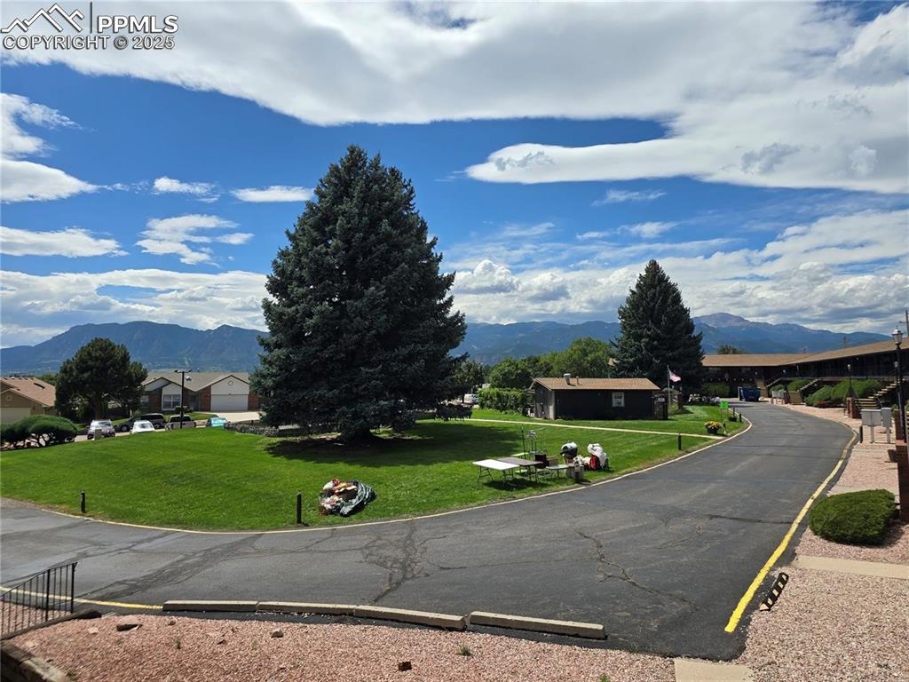 Image 16 of 18: View of asphalt street with a mountain view
