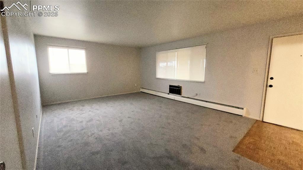Image 2 of 18: Living room with new carpet