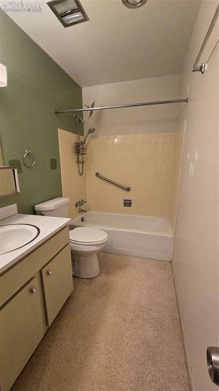 Image 6 of 18: Full bath with washtub / shower combination and vanity