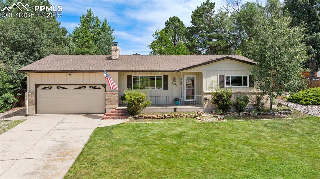 Caption: Single story rancher, two car garage with   covered front patio