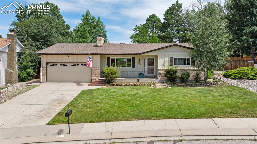Image 13 of 34: Single story home featuring brick siding, an attached garage, concrete driv