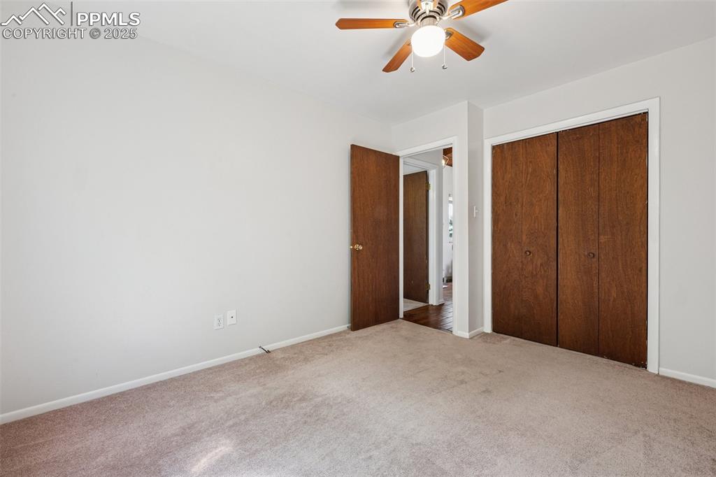 Image 32 of 34: Bedroom #2 with carpet, a closet, and a ceiling fan