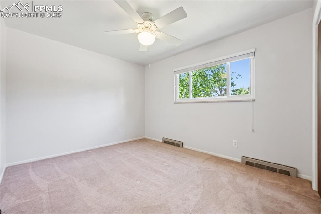 Image 33 of 34: Bedroom #3 featuring carpet and a ceiling fan