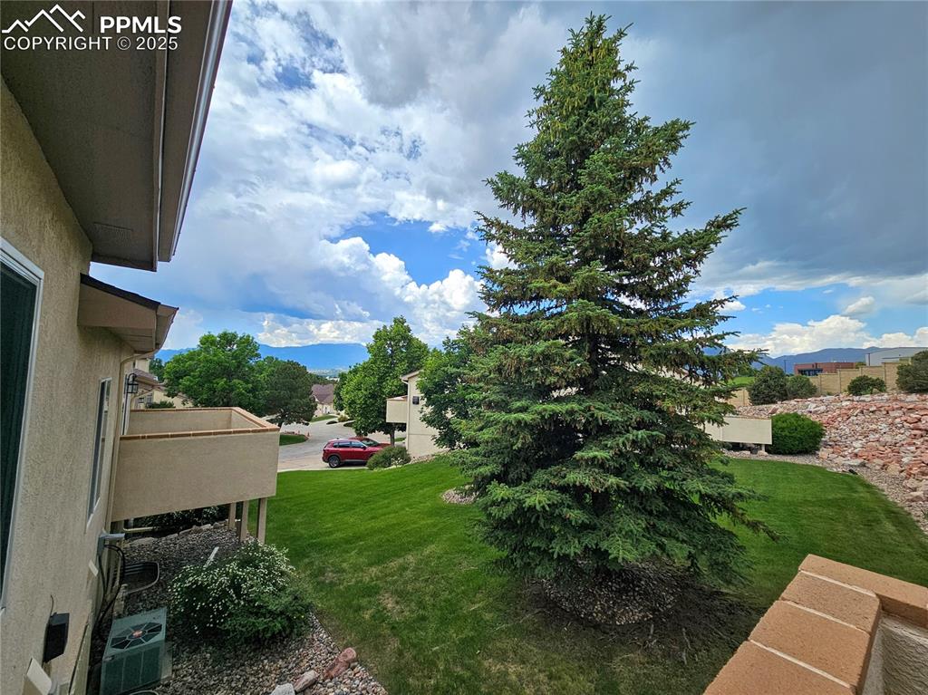 Image 7 of 42: view from deck outside of main level living room