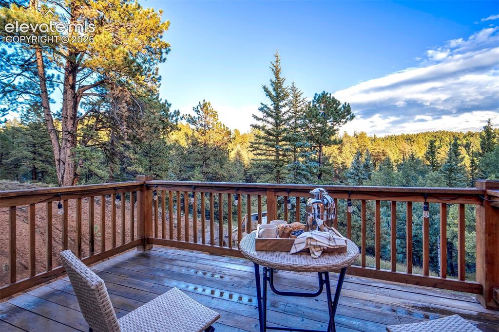 Image 20 of 50: Private deck off Primary Bedroom