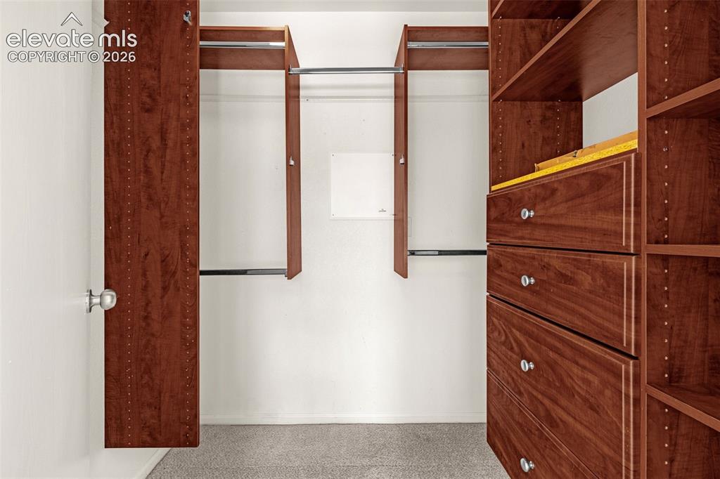 Image 19 of 34: Primary Bedroom walk-in closet