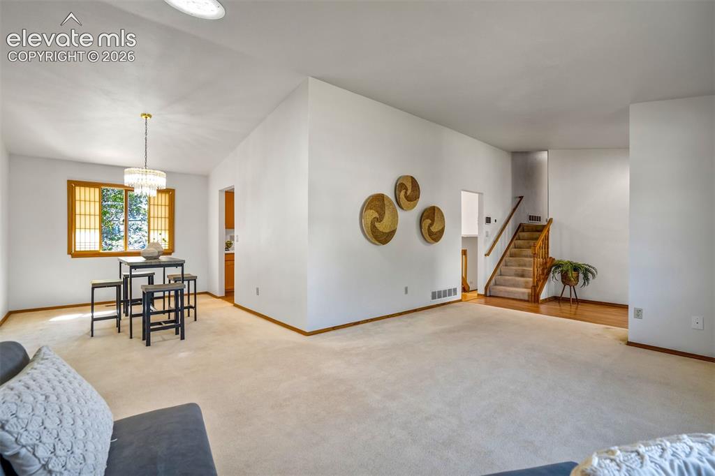 Image 11 of 50: Living Room opens to Formal Dining Room