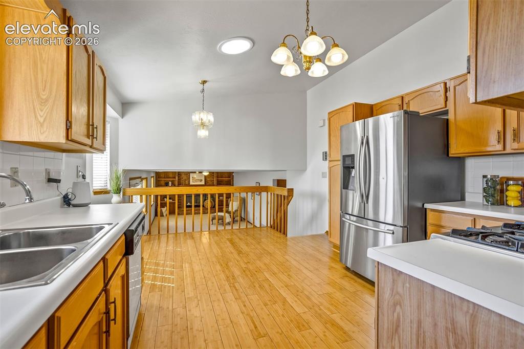Image 16 of 50: Kitchen leads to Family room