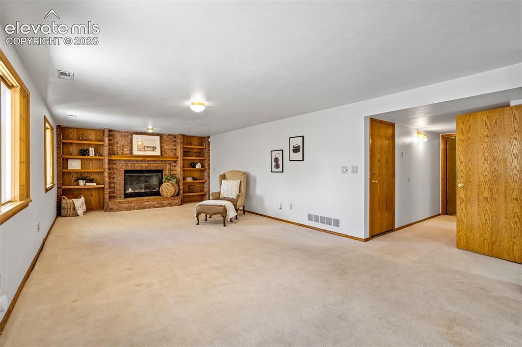 Image 20 of 50: A cozy fireplace in Family Room
