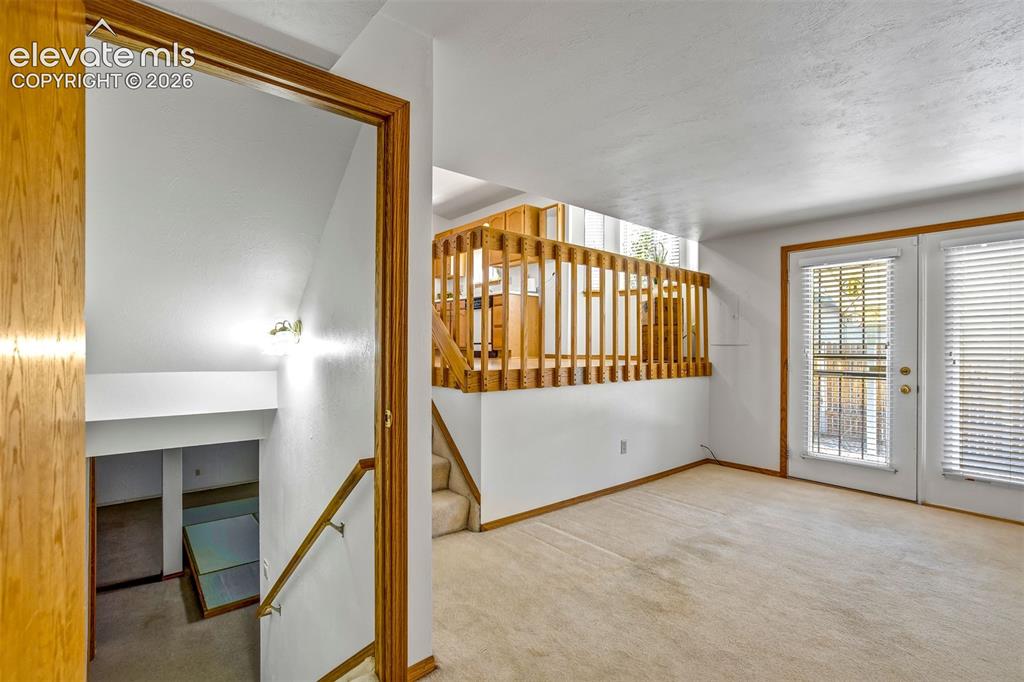 Image 23 of 50: Standing near garage and stairs down to basement
