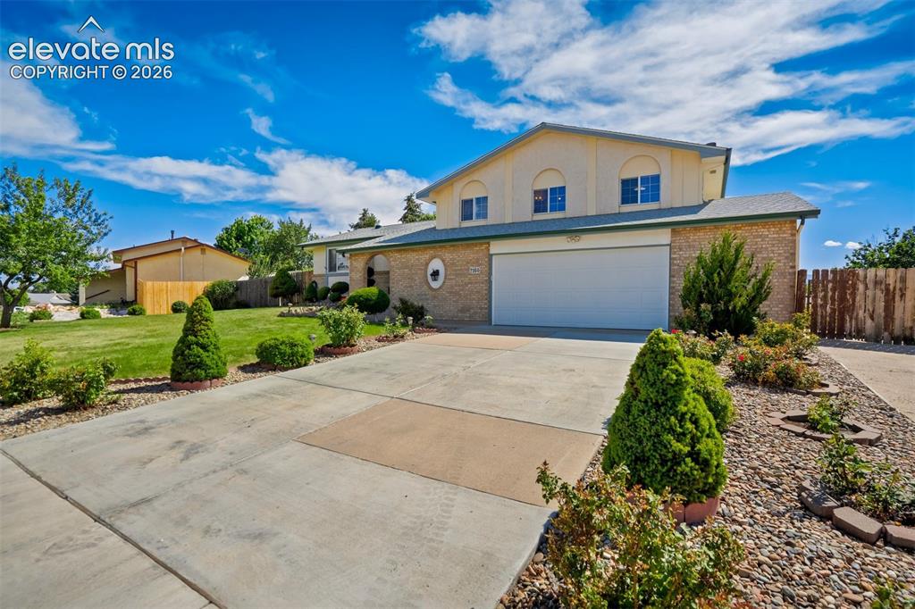 Image 3 of 50: Beautiful landscaping welcomes you home!