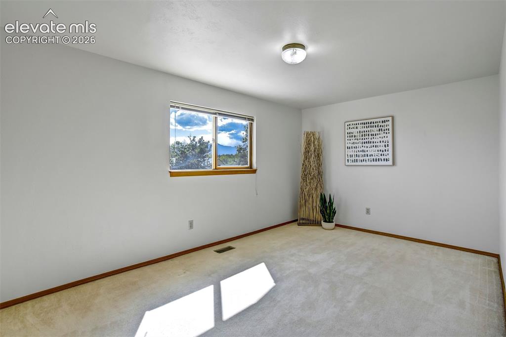 Image 35 of 50: A third bedroom on upper level
