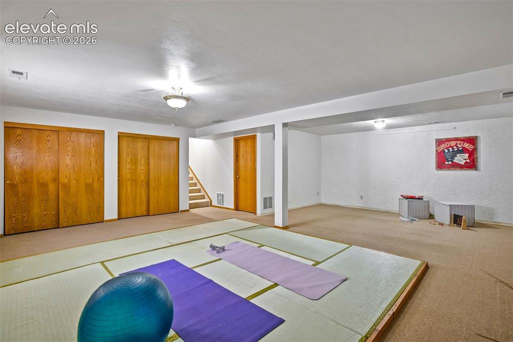 Image 38 of 50: A large basement with many options for use