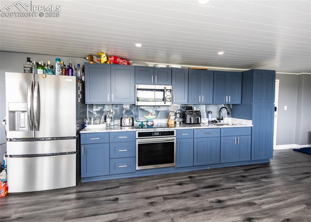 Image 10 of 32: Dishwasher is inside a cabinet door.