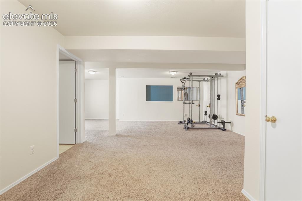 Image 22 of 37: Spacious interior featuring neutral carpet, recessed lighting, white walls,