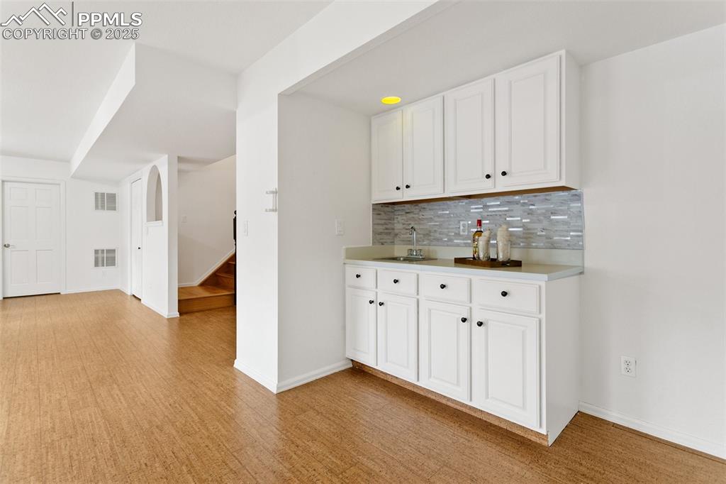 Image 32 of 47: Wet bar in Basement Family Room