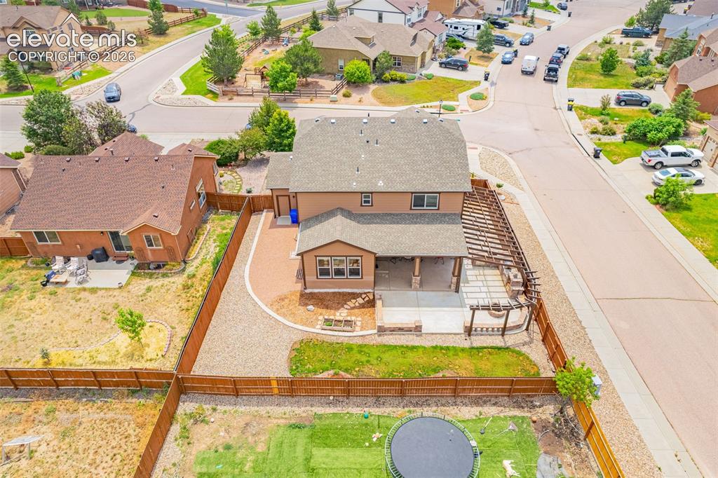 Image 44 of 49: Rear exterior featuring a covered patio, an open concrete patio, and an att