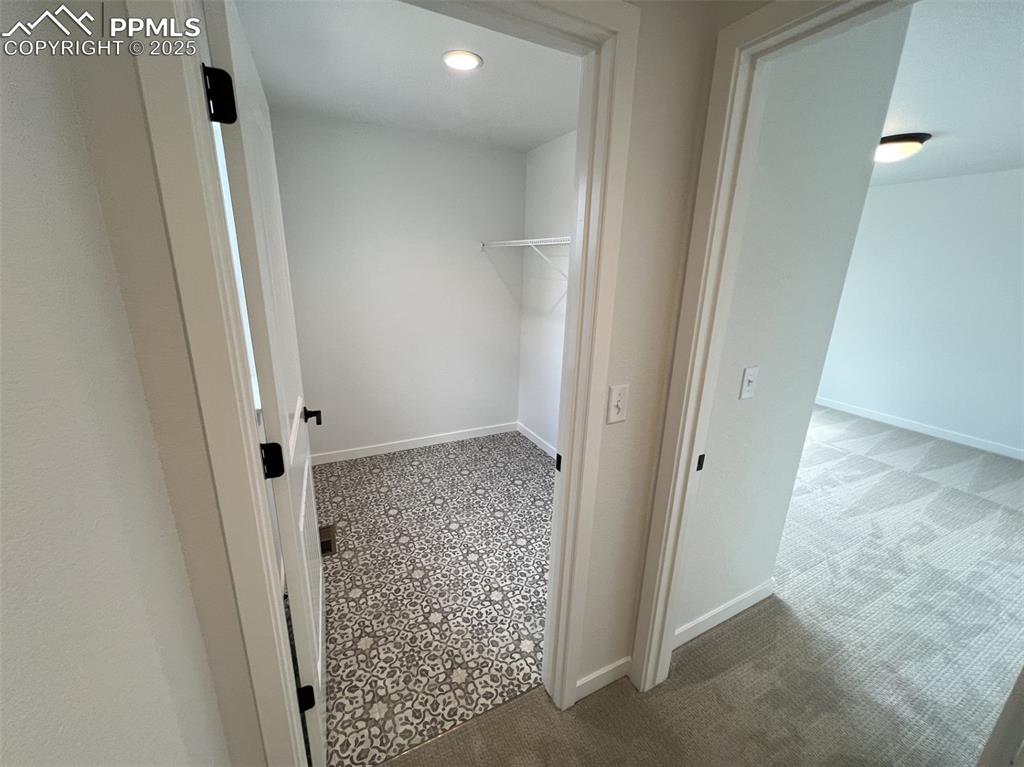 Image 11 of 17: Spacious laundry with natural light window