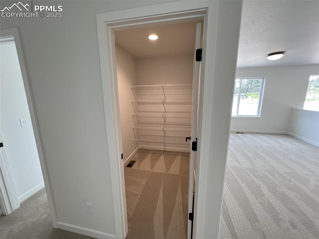 Image 15 of 17: View of large finished storage area upstairs