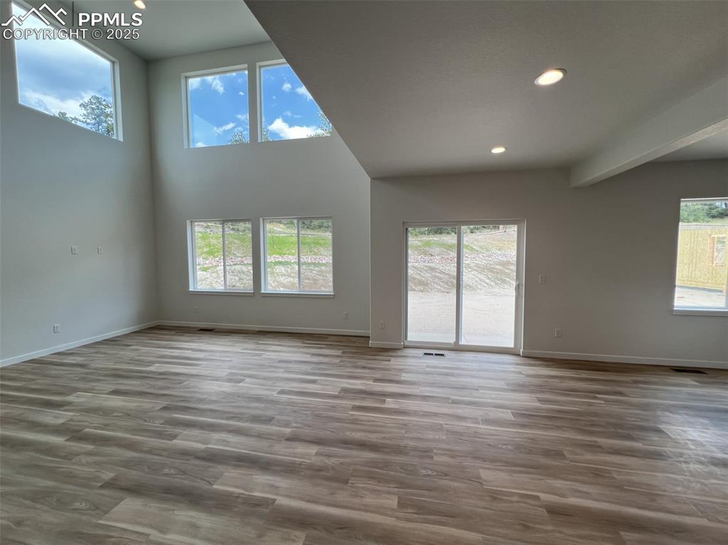 Image 5 of 17: Unfurnished living room featuring recessed lighting, light wood-style floor
