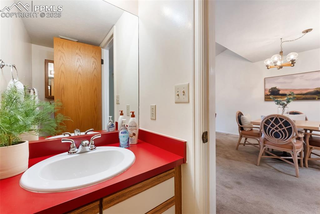 Image 13 of 30: Main level powder bath