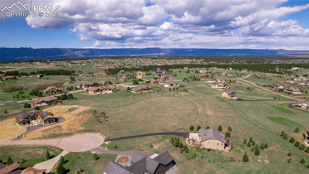 Image 10 of 18: Drone / aerial view featuring a residential view and a mountain view