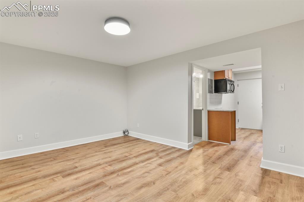 Image 31 of 48: Basement family room featuring LVP flooring 