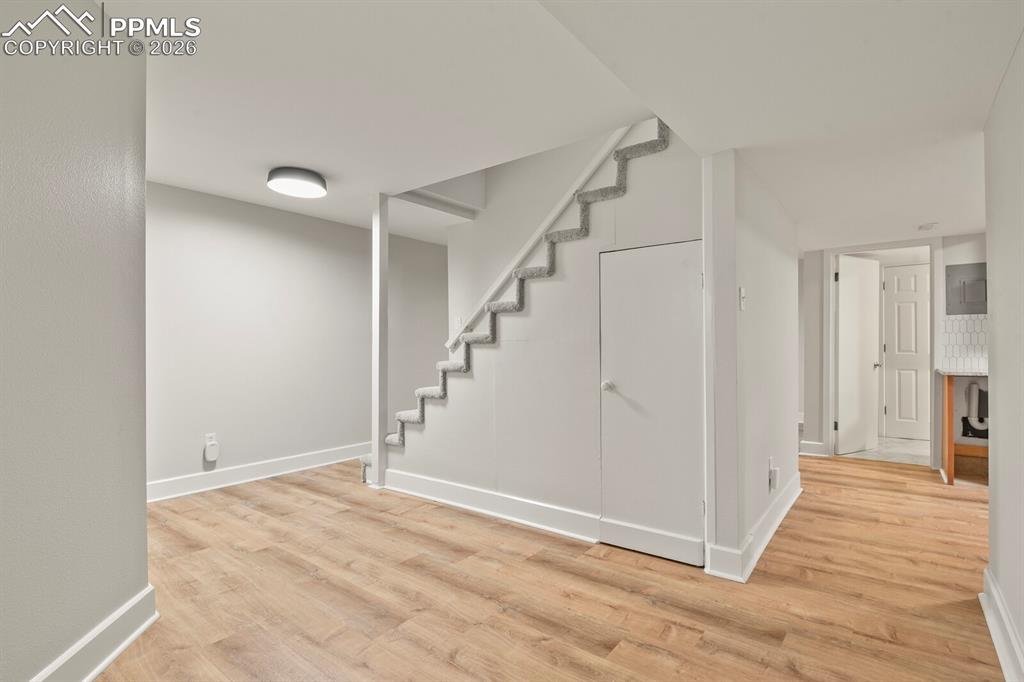 Image 32 of 48: Basement living area featuring LVP flooring 