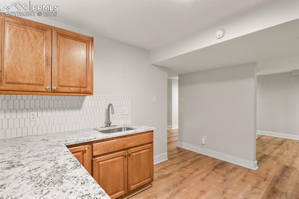 Image 34 of 48: Kitchenette featuring LVP flooring, microwave, sink, dishwasher hook up as
