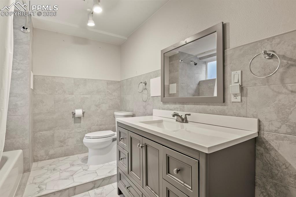 Image 38 of 48: Full bathroom located in the basement