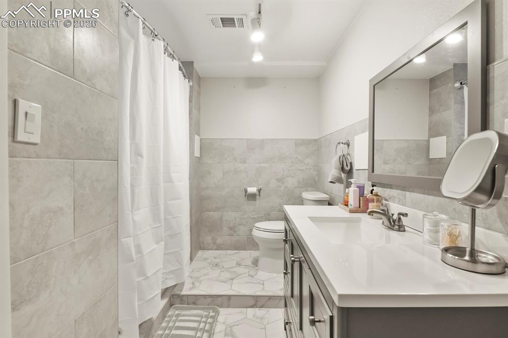 Image 39 of 48: Full bathroom located in the basement