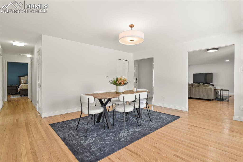 Image 5 of 48: Hardwood flooring extending throughout the space