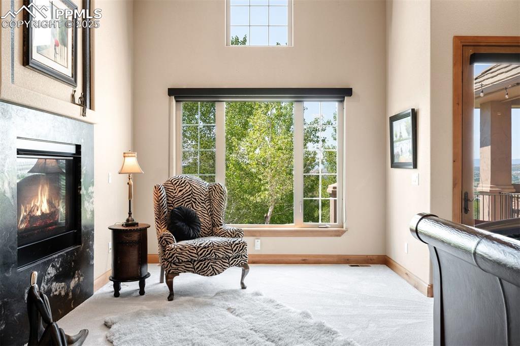 Image 20 of 47: Take advantage of a quiet afternoon by the 2 sided fireplace in the primary