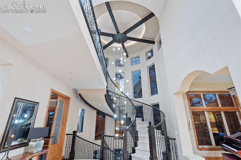 Image 24 of 47: Custom-designed by the homeowner, the handblown Italian glass orbs extend 3