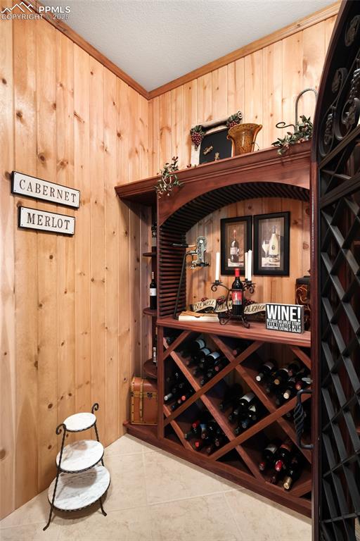 Image 29 of 47: Tucked discreetly in a quiet corner, the wine cellar has multiple storage o
